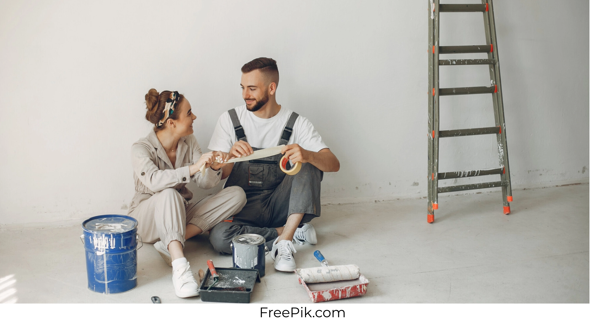 Couple decorating a room during an affordable home improvement project